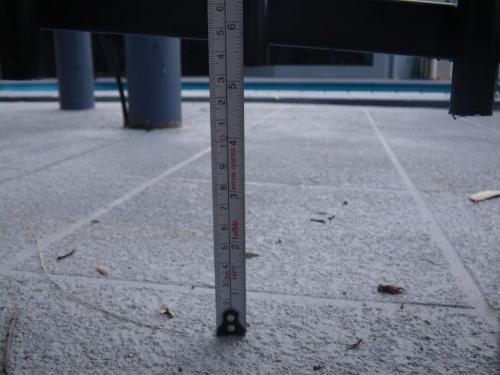 Gap under metal pool fence to patterned concrete exceeds 100mm maximum allowance