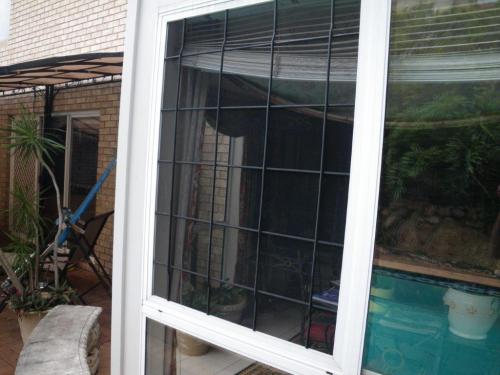 Double bunger! – temporary fixed window screen & a non-compliant sliding door