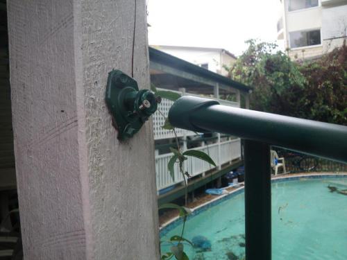 Broken top rail fitting at end of pool fence panel