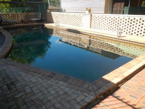 Breeze block boundary fencing provides ladder effect & direct access to pool zone