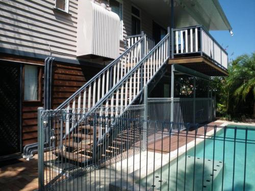 Climb along the outside of the house steps, over fence & in the pool