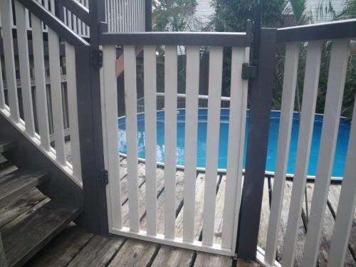 Angled steps provide direct climbable access over the pool gate into the pool zone