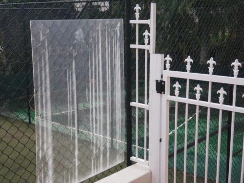 Perspex screen not doing too much as a child could walk along the white wall, climb up the small panel, scale the pool gate & climb down the chain wire on the other side