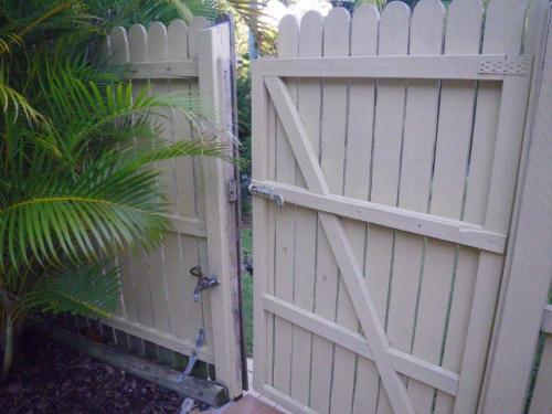 Rear boundary gate enters directly into unprotected pool zone from adjoining park. Note the   scalable tap on the outside of the gate which is only secured by a barrel bolt